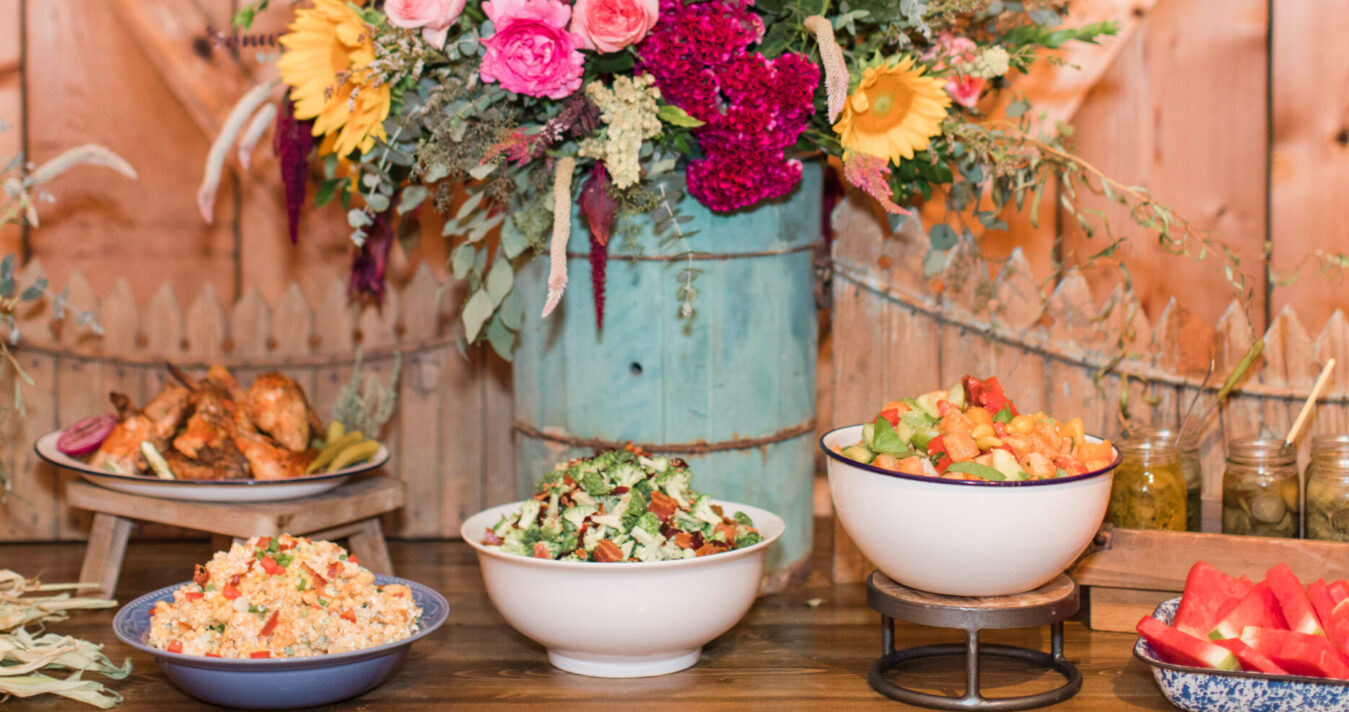 Spread of food on table with flowers